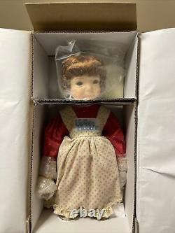 A Holly Hobbie Winter porcelain doll by Dianna Effner