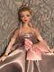 Ashton Drake Gene Love Paris doll wearing ooak gown of repro centerpiece