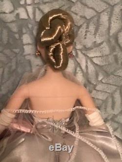 Ashton Drake Gene Love Paris doll wearing ooak gown of repro centerpiece