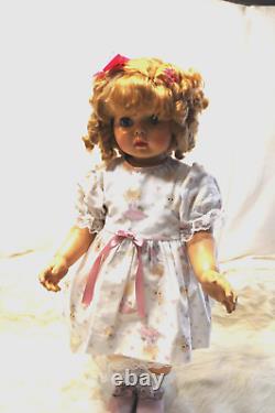 Penny Playpal made by Ashton Drake wearing White Dress with pink, slip and Shoes
